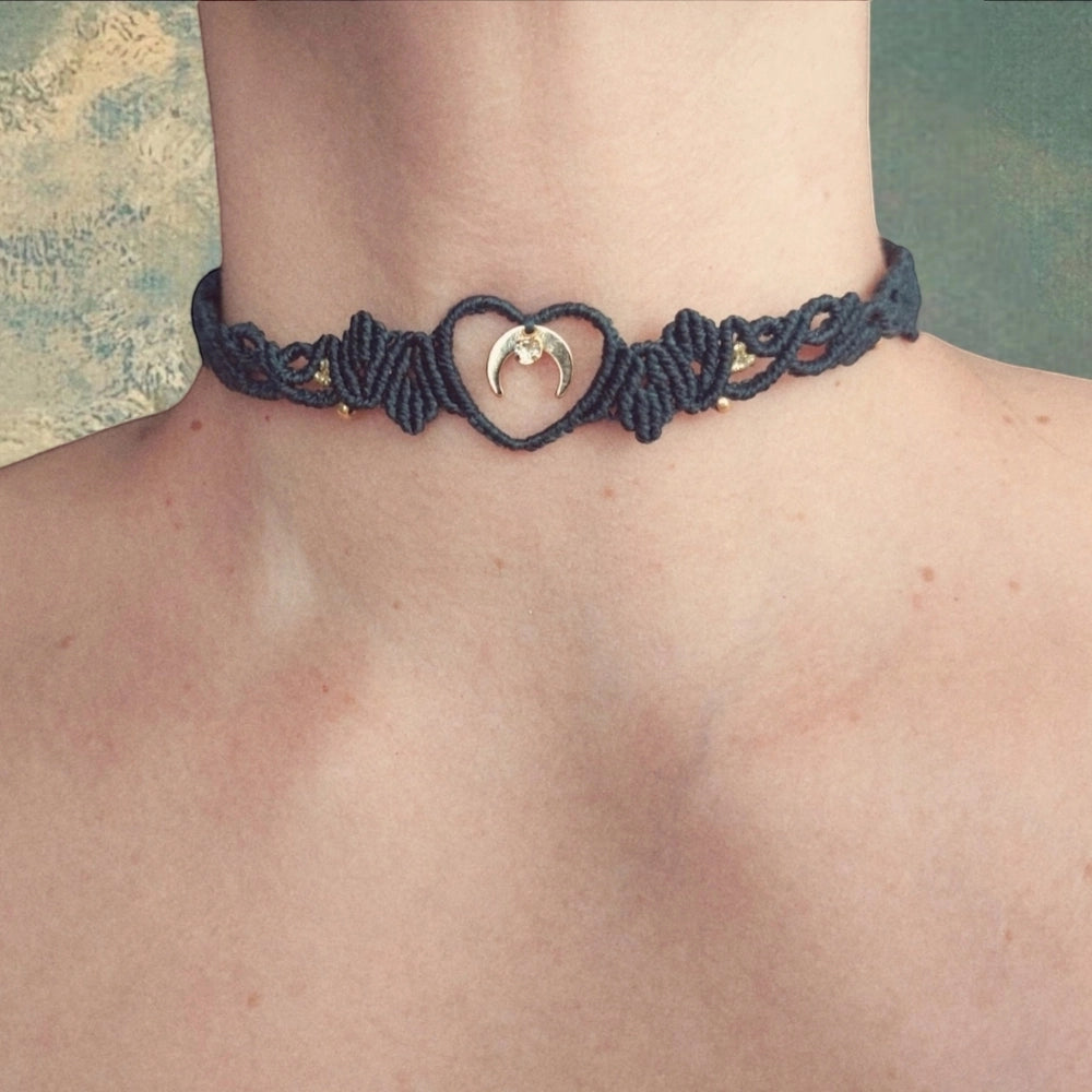 Boho macrame choker features a lovely crescent moon charm plated with 18K gold. This necklace is the perfect statement piece for any hippie-style outfit. This versatile piece can be worn as a crew neck necklace or even as a tiara.