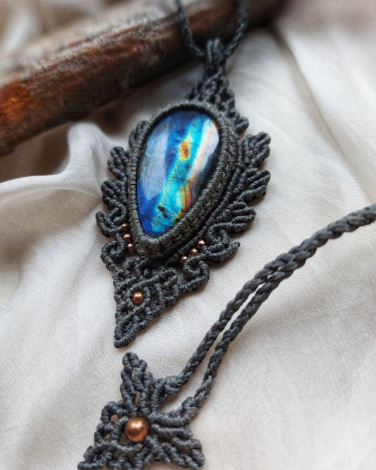This Spectrolite Labradorite Macrame Necklace is a stunning statement piece that features a 57ct teardrop-shaped gemstone with full flash and AAA quality.