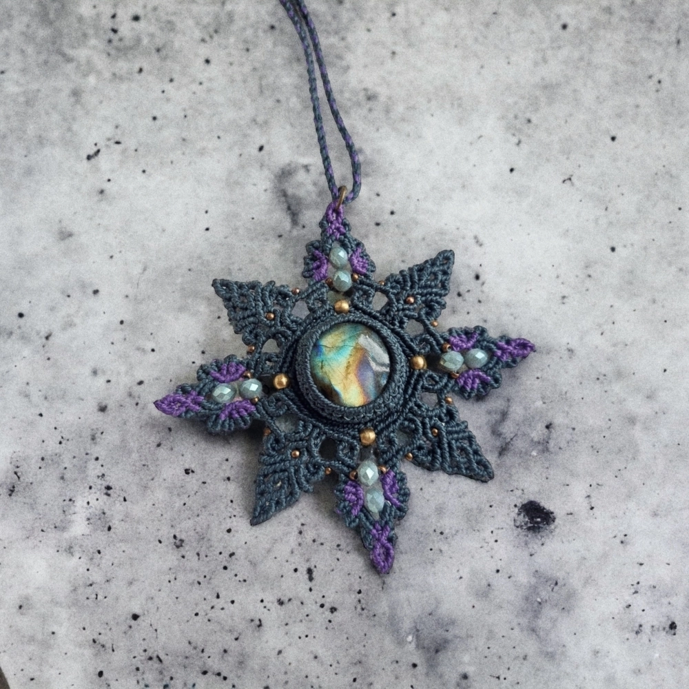 This Spectrolite Labradorite Macrame Necklace is a stunning statement piece that features a 37ct round-shaped gemstone with full flash and AAA quality.