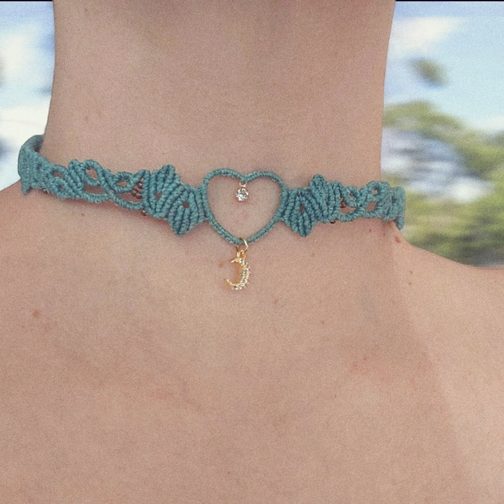 Boho macrame choker features a lovely crescent moon charm plated with 18K gold. This necklace is the perfect statement piece for any hippie-style outfit. This versatile piece can be worn as a crew neck necklace or even as a tiara.