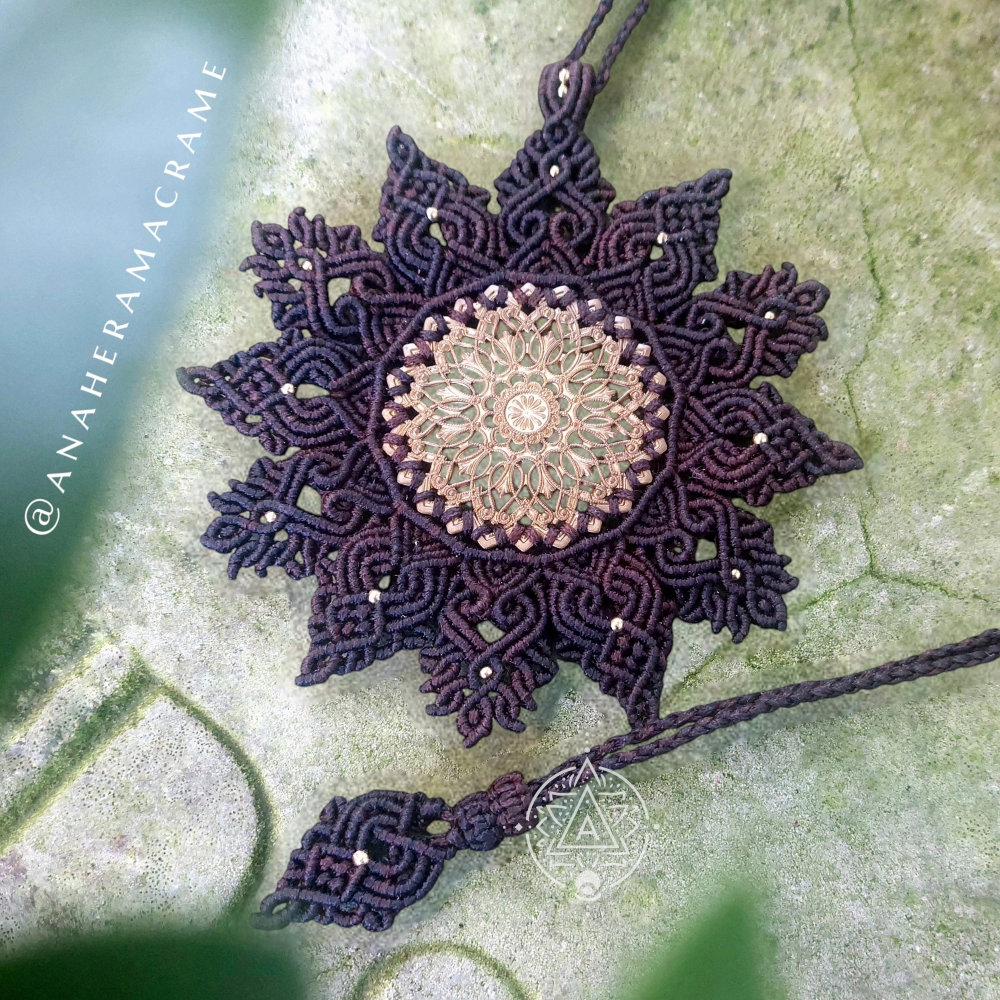 Adjustable macrame mandala necklace with ornate brass filigree design.  
