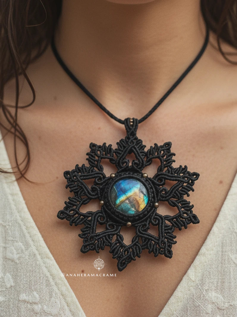 A brown lace pendant with a colorful stone on a person's neck, featuring the brand 'Anahera Macrame', is visible.