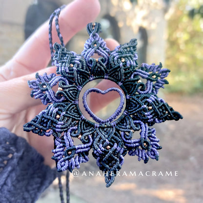 Bohemian-style purple and black macrame necklace with heart design.  
