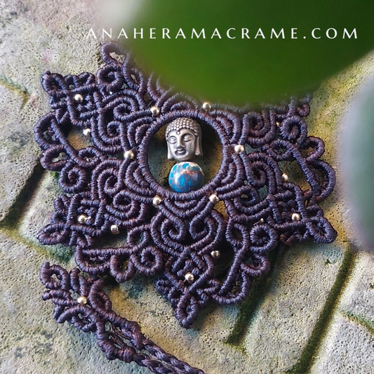 Handcrafted mandala necklace featuring imperial jasper beads and a Buddha centerpiece, adjustable with a sliding lock.
