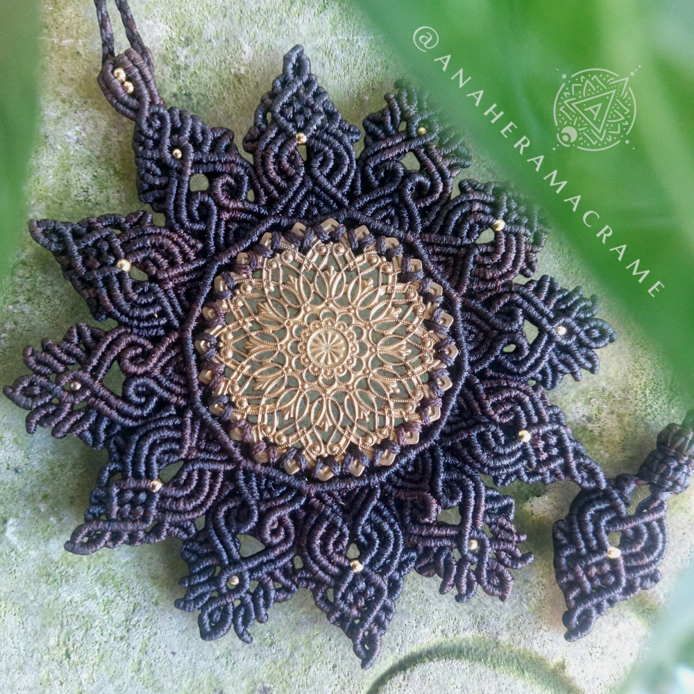 Mandala macrame necklace with an intricate brass filigree centerpiece.  
