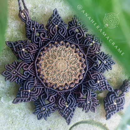 Mandala macrame necklace with an intricate brass filigree centerpiece.  
