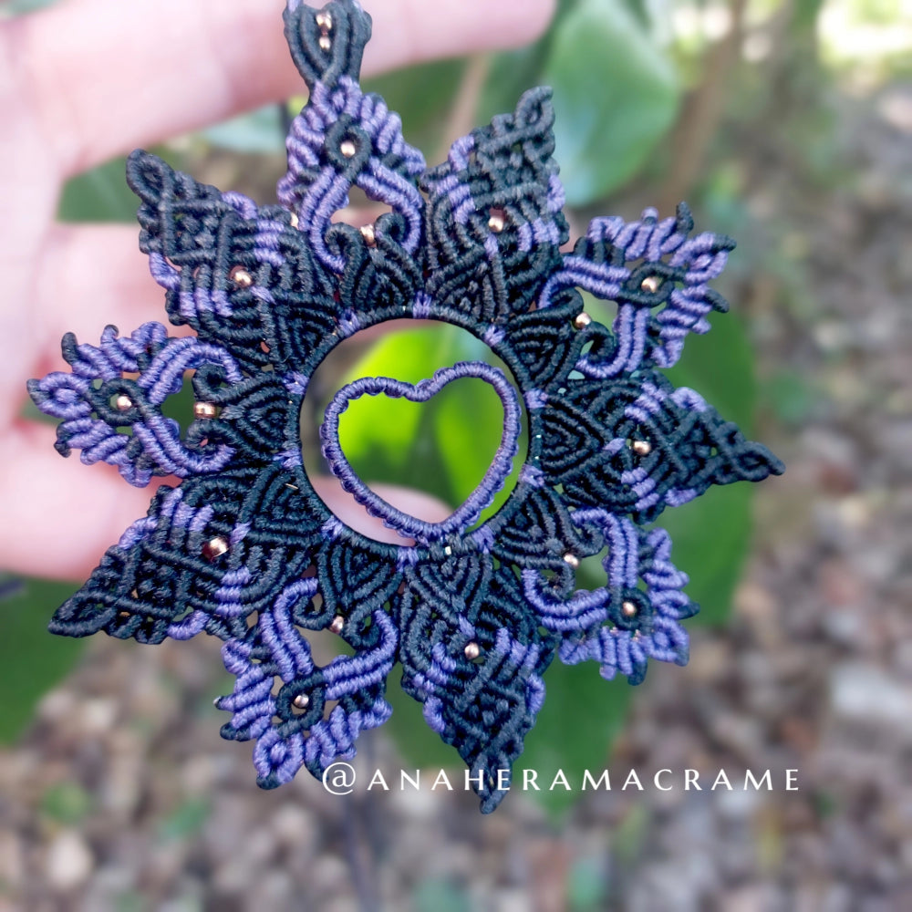 Purple and black mandala macrame necklace with an intricate heart centerpiece.  

