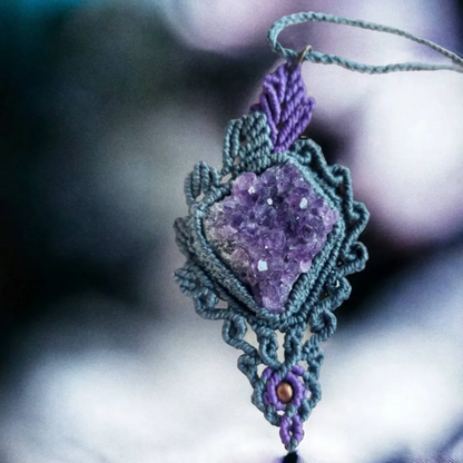 A raw Amethyst pendant that boasts a unique design. This statement necklace features a beautiful amethyst druzy cluster that is raw and unpolished, giving it a natural and earthy feel.