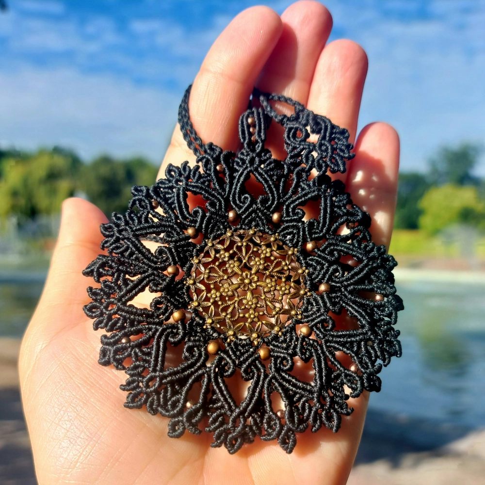 Spiritual black mandala necklace with a vintage brass filigree pendant.