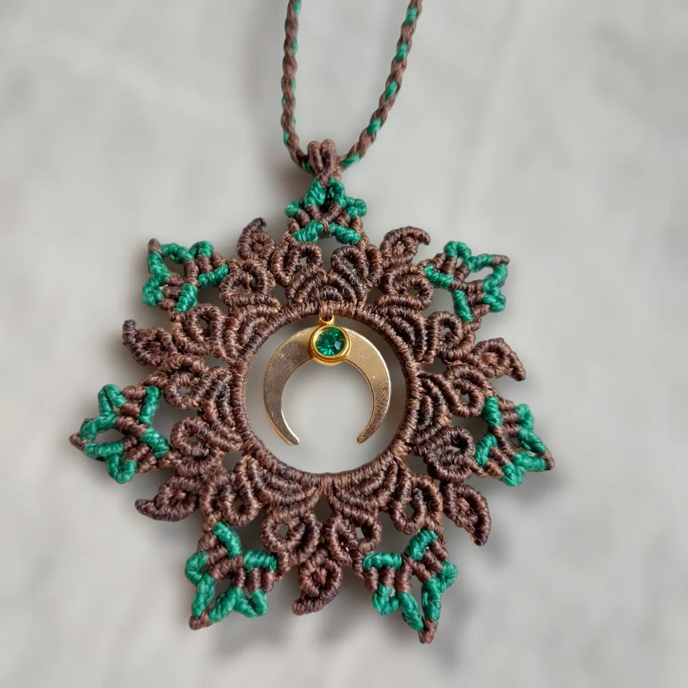 Boho macrame mandala necklace in earthy green and brown tones, adorned with a crescent moon and Rhinestone charm. Adjustable up to 23 inches with a slide lock for a perfect fit.