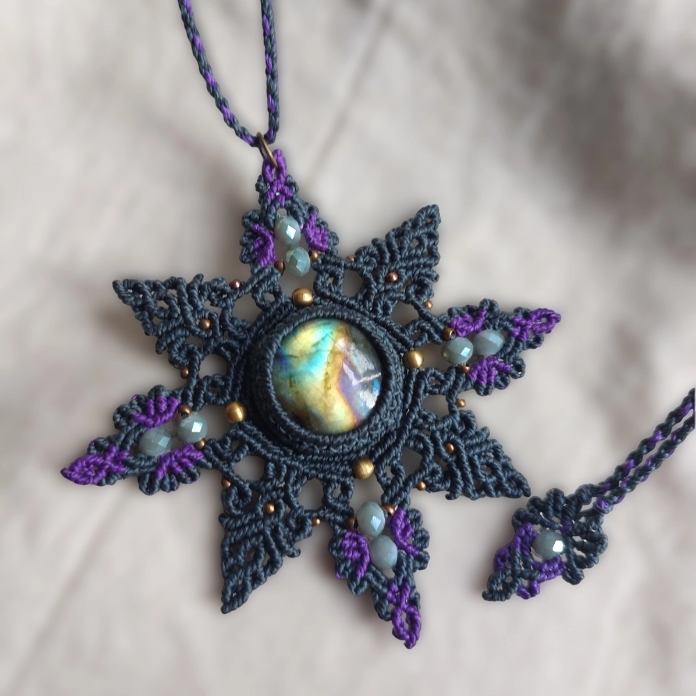 This Spectrolite Labradorite Macrame Necklace is a stunning statement piece that features a 37ct round-shaped gemstone with full flash and AAA quality.