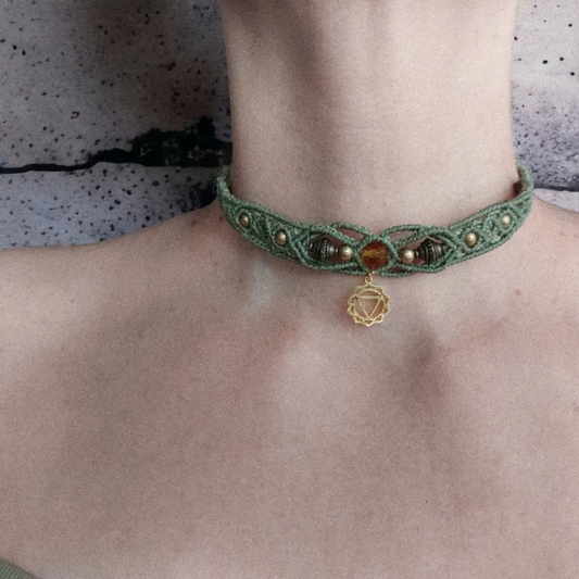 The Boho macrame choker features The Solar Plexus Chakra charm that's plated with 18K gold. Also known as Manipura, is the third chakra in the body's energy system. It is located in the area of the abdomen