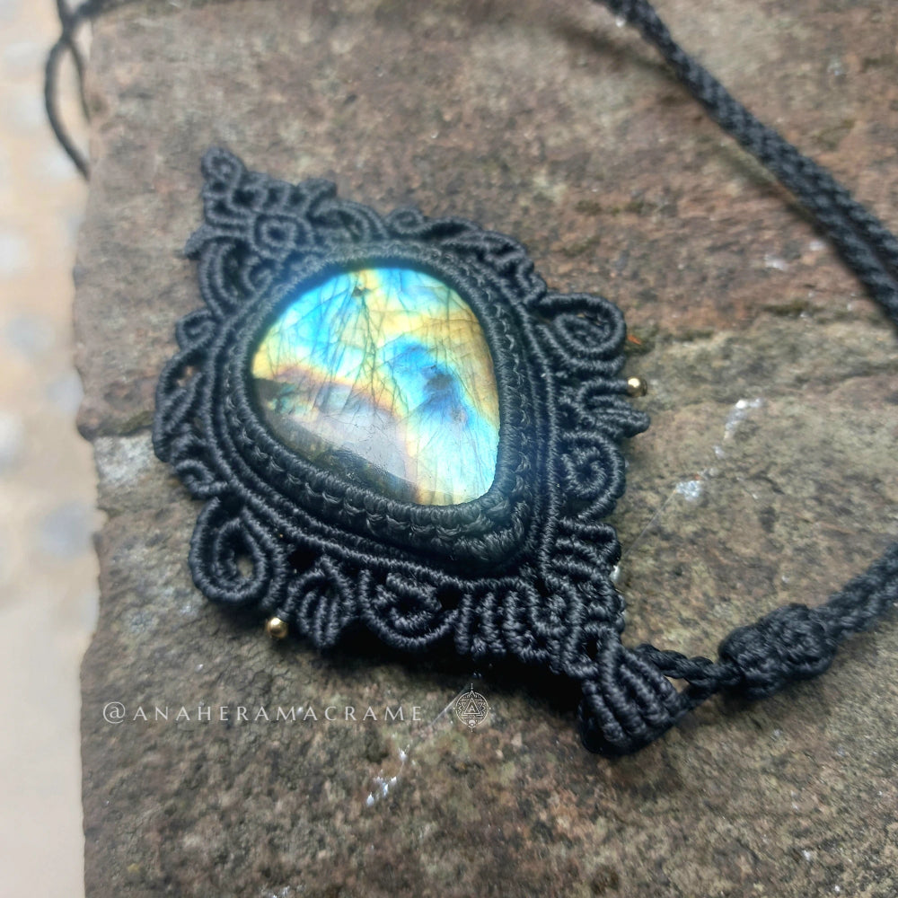 Artisan macrame necklace showcasing a large 53ct labradorite stone in teardrop shape with handmade fiber art details
