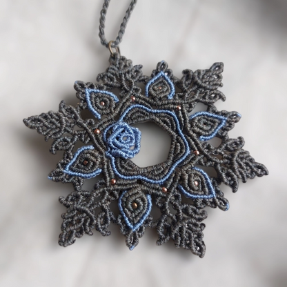 This Macrame Mandala Necklace is a stunning statement piece that features a beautiful blue rose
