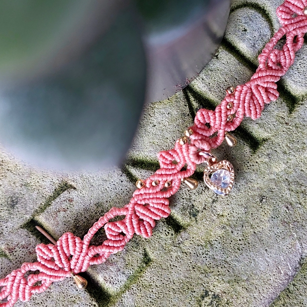 Boho-inspired macrame choker with a romantic Cubic Zirconia heart charm, lightweight and adjustable for all-day wear.
