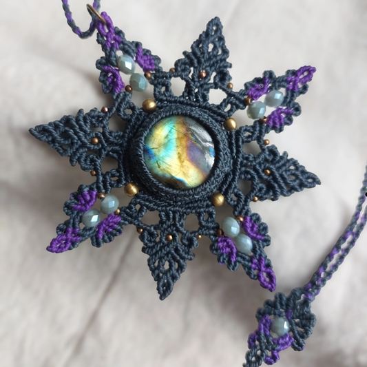 This Spectrolite Labradorite Macrame Necklace is a stunning statement piece that features a 37ct round-shaped gemstone with full flash and AAA quality.
