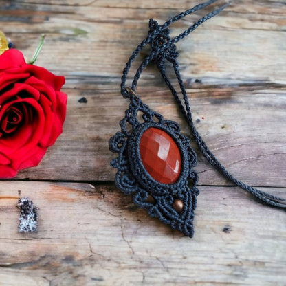 This necklace is made with red jasper gemstones and macrame weaving techniques, giving it a natural, earthy feel that's perfect for any bohemian style. The rose-cut gemstone adds a touch of elegance to the piece.  The total length of the necklace, including the pendant, measures approximately 56cm/ 22 inches and it is adjustable to fit your preferred length with a convenient slide lock.