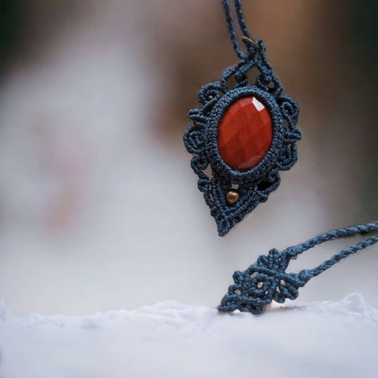 This necklace is made with red jasper gemstones and macrame weaving techniques, giving it a natural, earthy feel that's perfect for any bohemian style. The rose-cut gemstone adds a touch of elegance to the piece.  The total length of the necklace, including the pendant, measures approximately 56cm/ 22 inches and it is adjustable to fit your preferred length with a convenient slide lock.